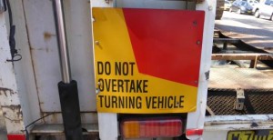 do not overtake turning vehicle